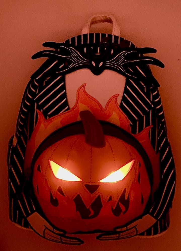 Loungefly Jack Pumpkin Light Up Glow Mini Backpack NBC Bag Lights Off Front Full View Light Up Effect And Glow In The Dark Effect