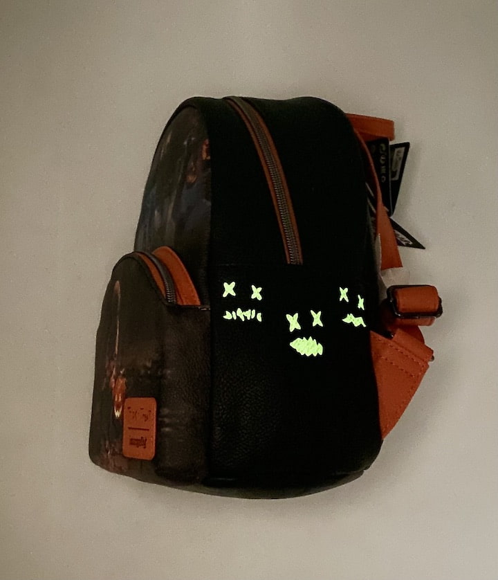Loungefly Trick or Treat Mini Backpack Halloween Trick 'r Treat Bag Glow In The Dark Left Side
