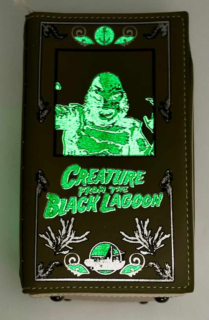 Loungefly Universal Monsters Books Collection Glow Crossbody Bag Glow In The Dark Effect Left Side