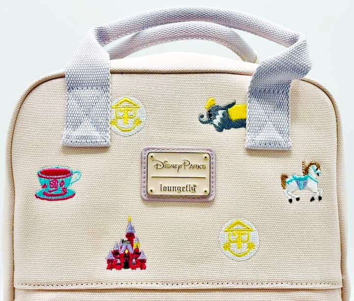 Loungefly Walt Disney World Icons Canvas Mini Backpack Fantasyland Bag Front Logo
