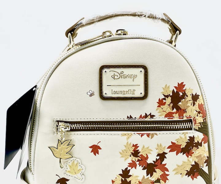 Loungefly Winnie the Pooh Friends Fall Autumn Scenes Mini Backpack Front Enamel Logo